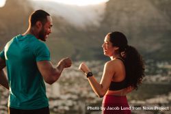 Fitness couple giving fist bump after the workout 5kOpP5