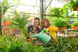Happy women working in greenhouse