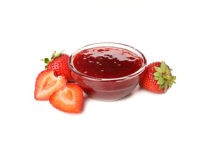 Delicious strawberry jam isolated on plain background