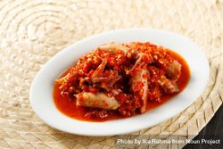 Spicy salted squid dish on placemat 5aNaW4