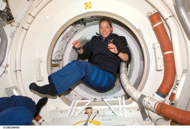 Commander Pam Melroy is photographed in the Orbiter Docking Compartment