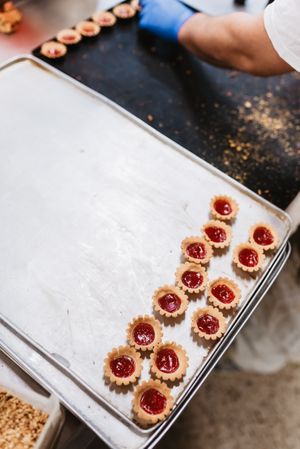 Tray with pig shaped desserts in bakery
