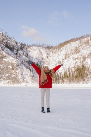 Frozen woman wrapped in scarf on winter day