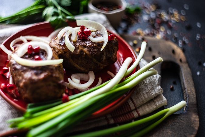 Plate of Georgian abkhazura cutlets on plate with spring onions