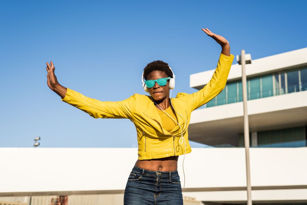 Joyful female smiling and jumping