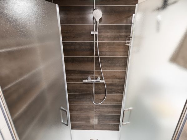 New shower cabin after renovation. Purity and freshness.