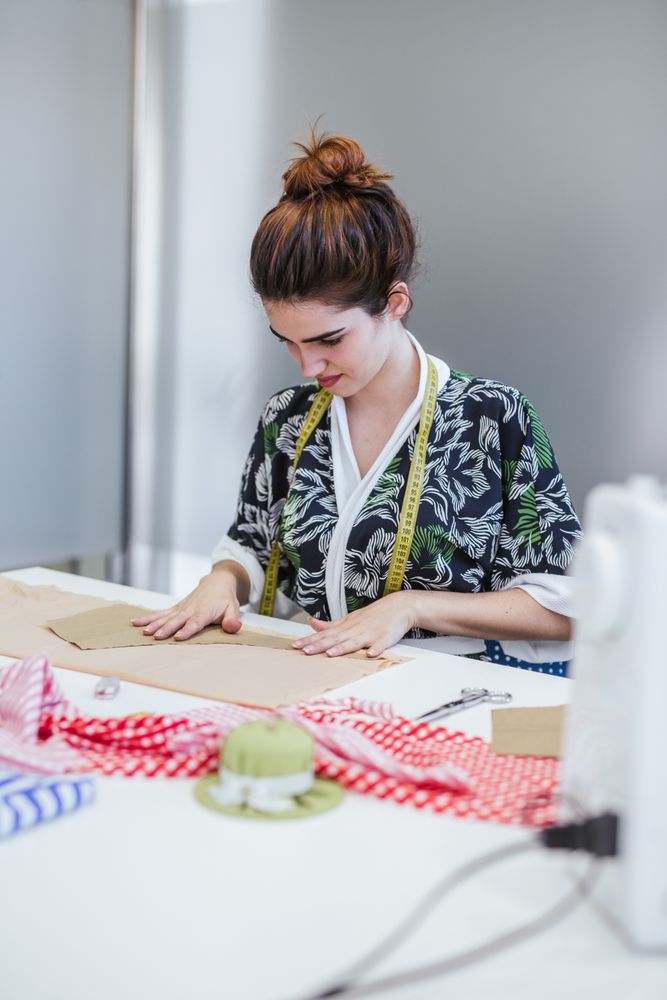 Woman in a sewing school