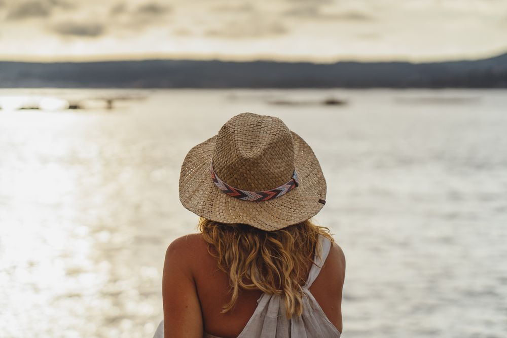 Blond woman resting at seaside