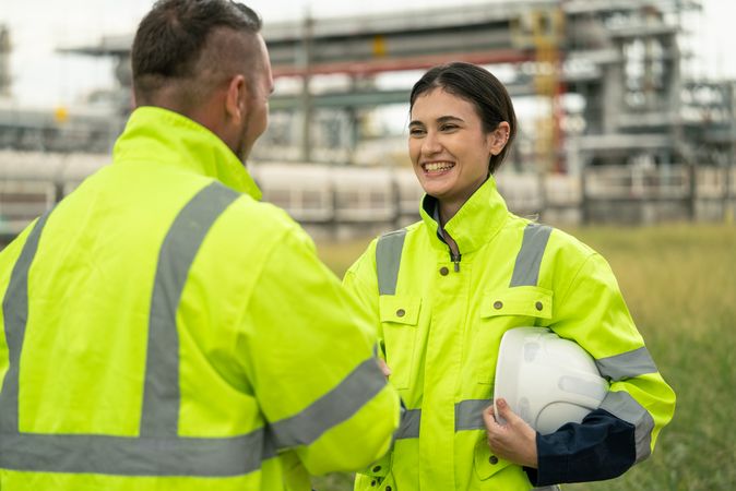 Engineer worker hand shaking to colleagues team for success work