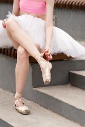 Unrecognizable ballet dancer in city street