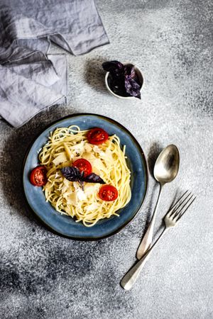 Top view of Italian pasta with cherry tomatoes