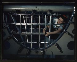 Fort Worth, TX, USA - 1942: Female a mechanic at a western aircraft plant 56lydb