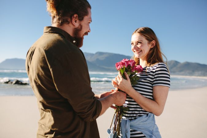 Man surprising girlfriend on a romantic date