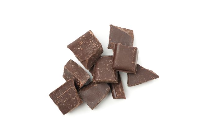 Tasty chocolate pieces isolated on blank background