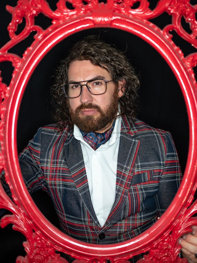 Portrait of imposing man in red art frame