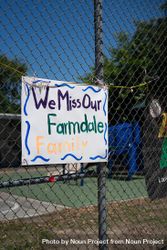 Sign taped to schoolyard fence made by teachers missing their students from school 4jVJW4