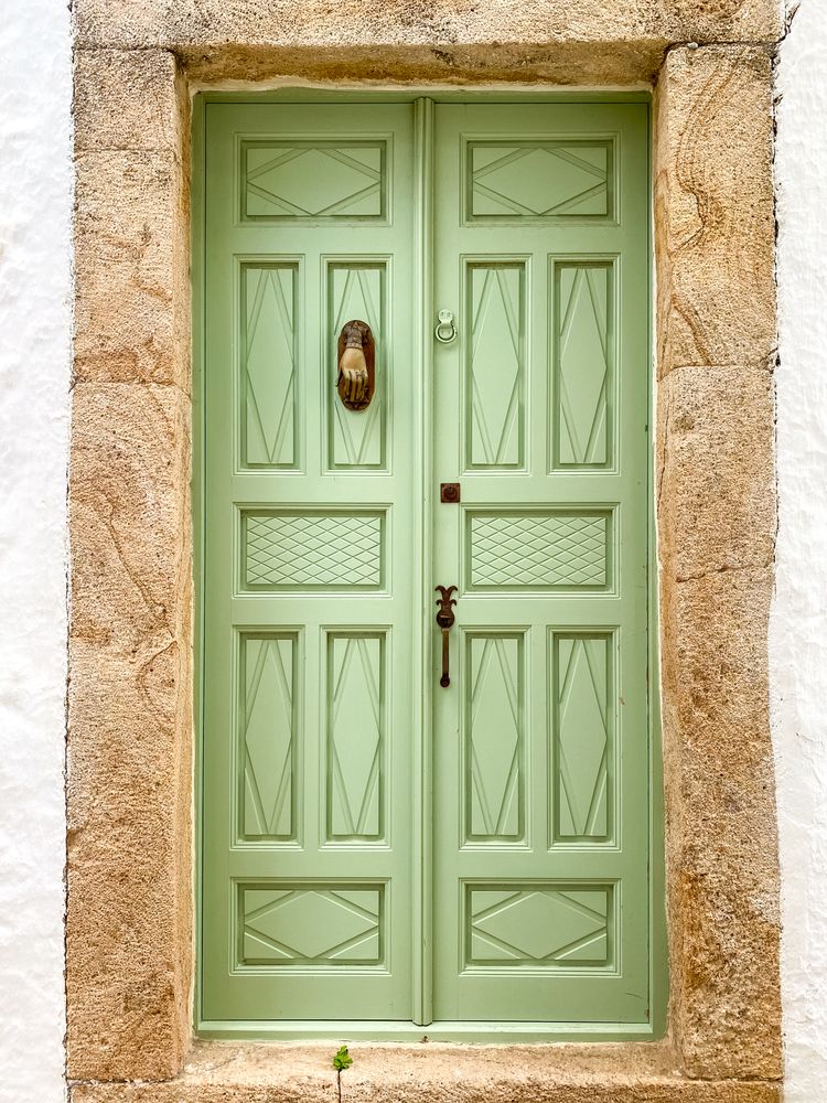 Patmian green door with hand knocker