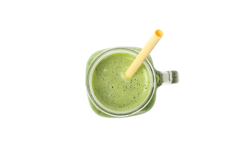 Smoothie of green vegetables isolated on blank background