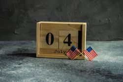 USA flags for Independence Day on grey counter
