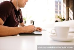 Cropped shot of young male designer working remotely from home in bright office 5p8Oy5