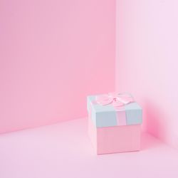 Pink and baby blue jewelry gift box on pastel backdrop