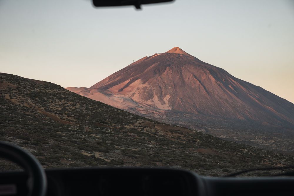 View of mountain through window of car
