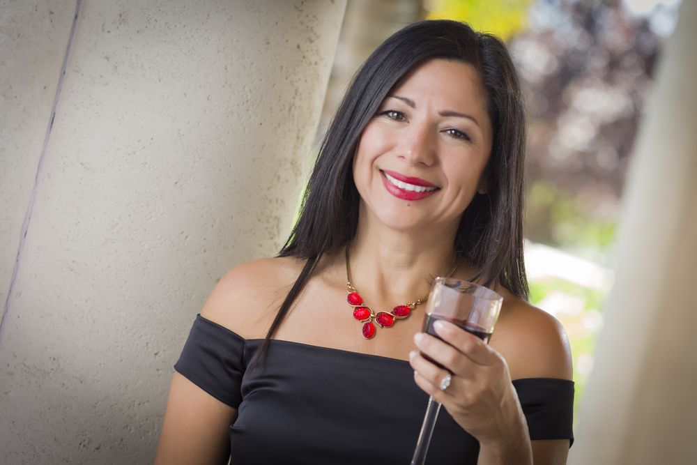 Hispanic Woman Portrait Outside Enjoying Wine