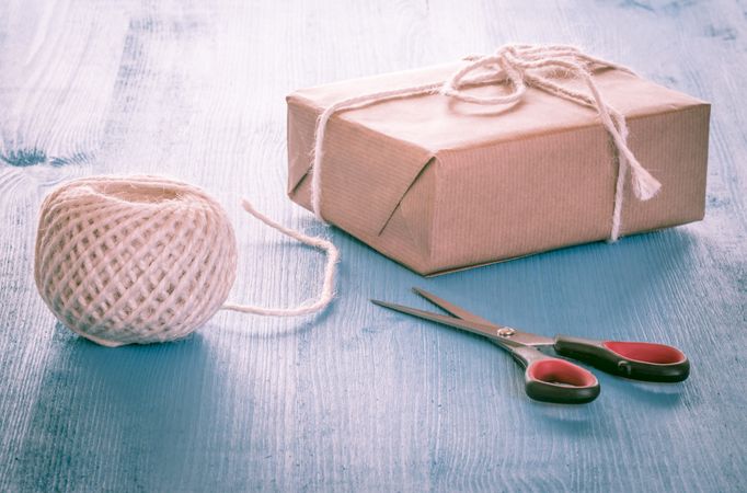 Present wrapped in plain brown paper and tied with twine