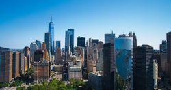 Scenic Aerial New York City View of Lower Manhattan Architecture. Panoramic Wall Street Financial District Shot from a Helicopter. Cityscape with Office Buildings and Skyscrapers