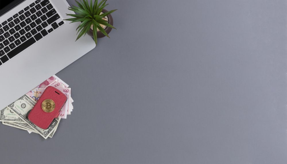 Portable wireless desktop with traditional paper money and bitcoin