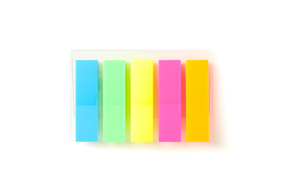 Color stickers in transparent packaging isolated on studio background