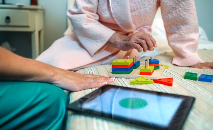 Female doctor showing shapes to patient