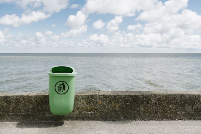 Trash can on concrete clean embankment