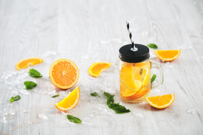 Single glass of orange infused water
