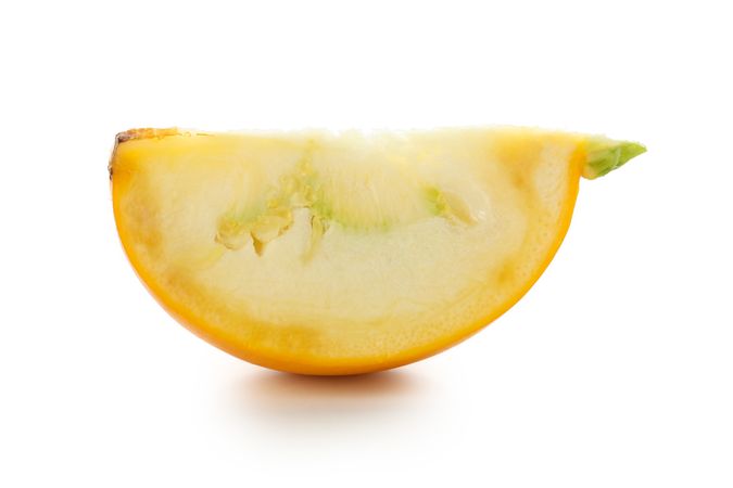 Fresh zucchini slice isolated on plain background