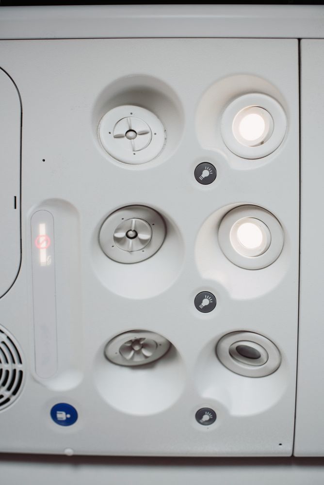 aircraft ceiling compartment with different buttons