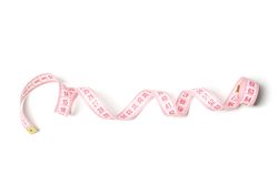 Measuring tape isolated on light background. Weight loss