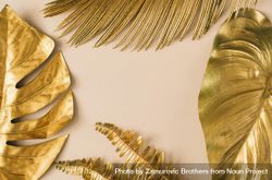 Border of gold leaves on beige background 4BjzX4