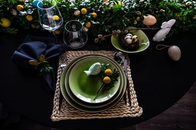 Top view of decorative ceramic bird on plate for spring table setting