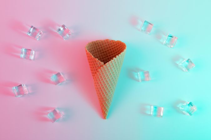 Ice cream waffle cone and ice cubes  in vibrant bold gradient holographic colors