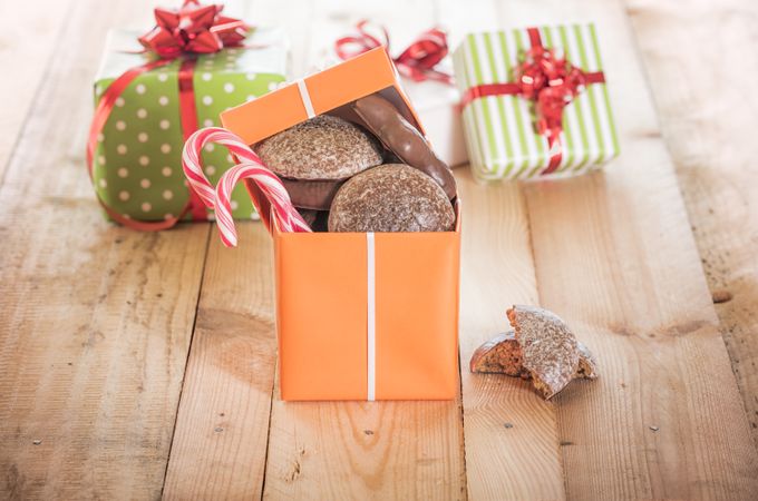 Three festive gifts on wood table