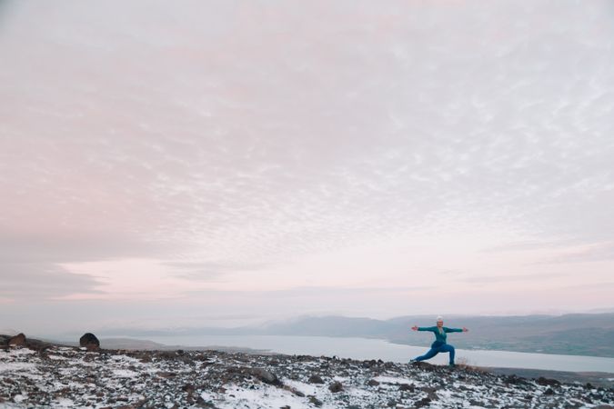 Woman posing on hill in snow