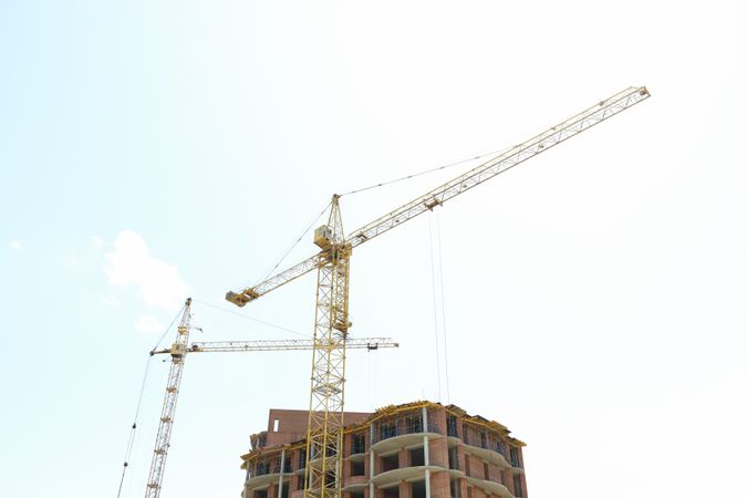 Working big yellow crane in construction site