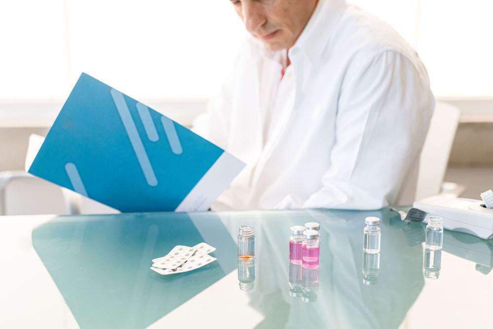 Pensive man writing down results of research
