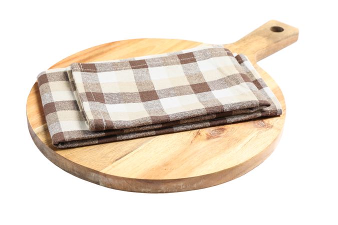 Cutting board with kitchen towel isolated on plain background