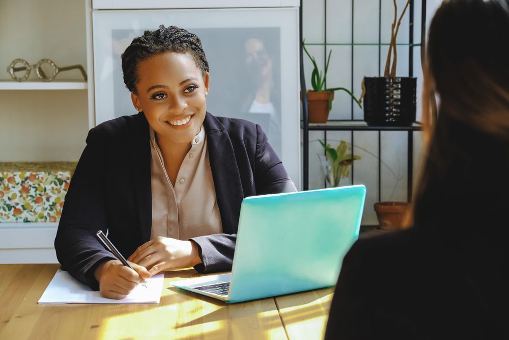 Happy business owner taking a meeting in bright office