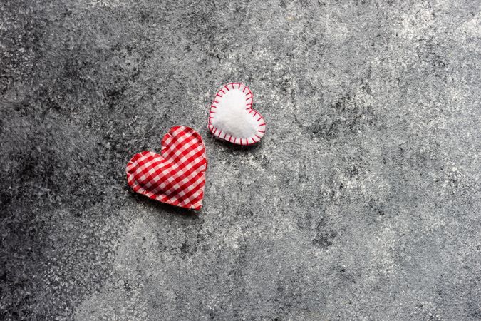 Valentine's day concept with felt hearts on grey counter