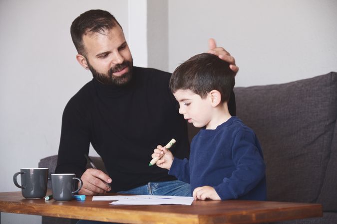 Father and son drawing together
