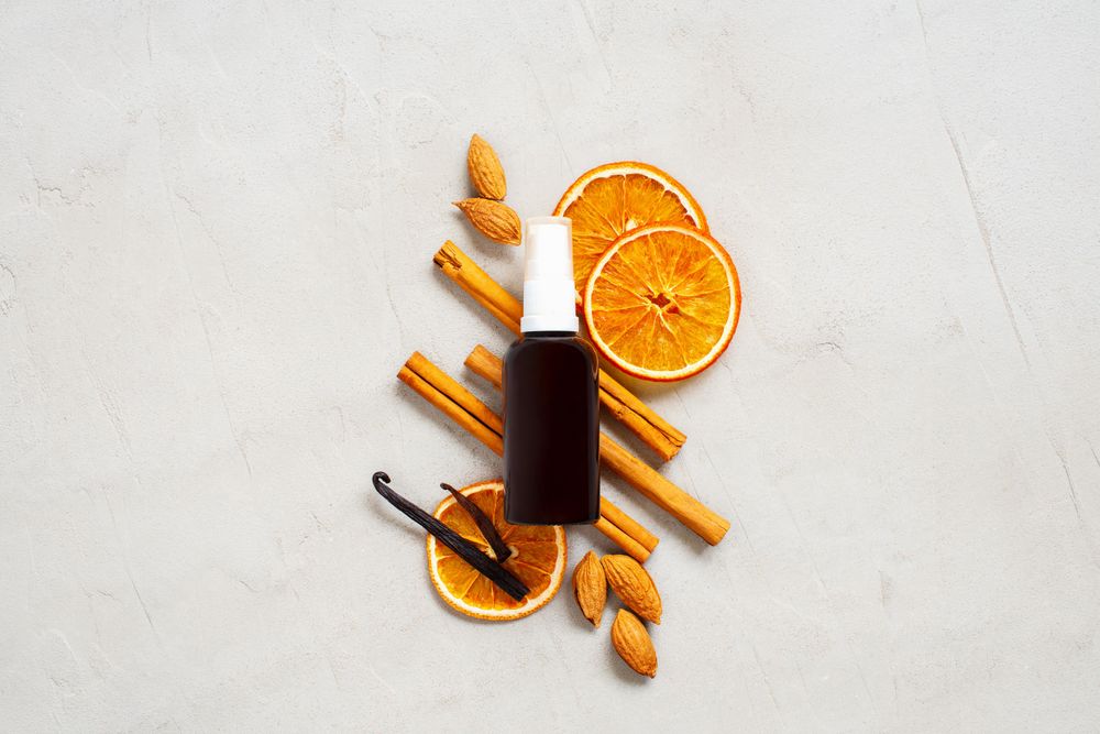 Glass bottle with ingredients for natural essence, oil or perfume