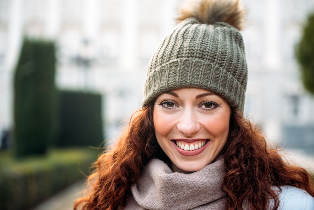 Beautiful redhead woman in the streets of Madrid on winter